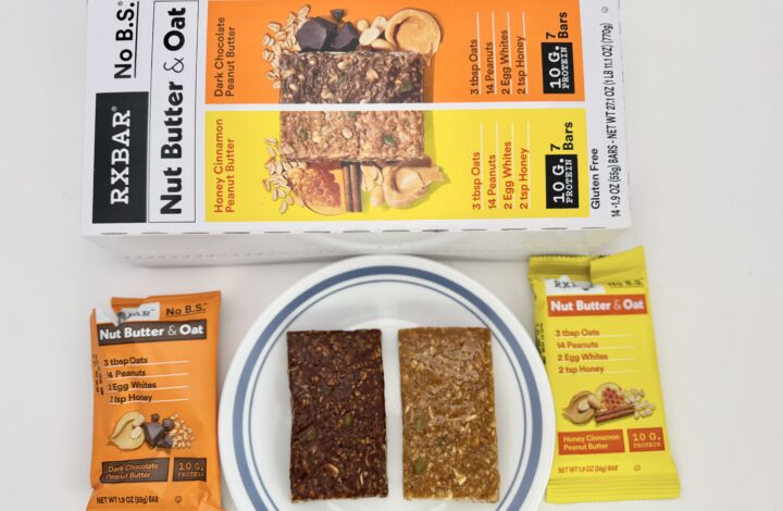 A 14-count variety pack box of RXBAR Nut Butter & Oat bars from Costco, featuring Honey Cinnamon and Dark Chocolate Peanut Butter flavors.