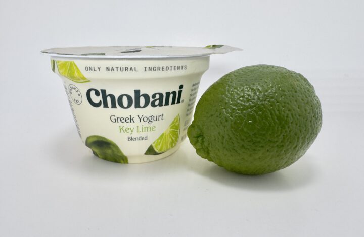 Chobani Greek Yogurt Key Lime Blended cup shown next to a whole, fresh green lime.