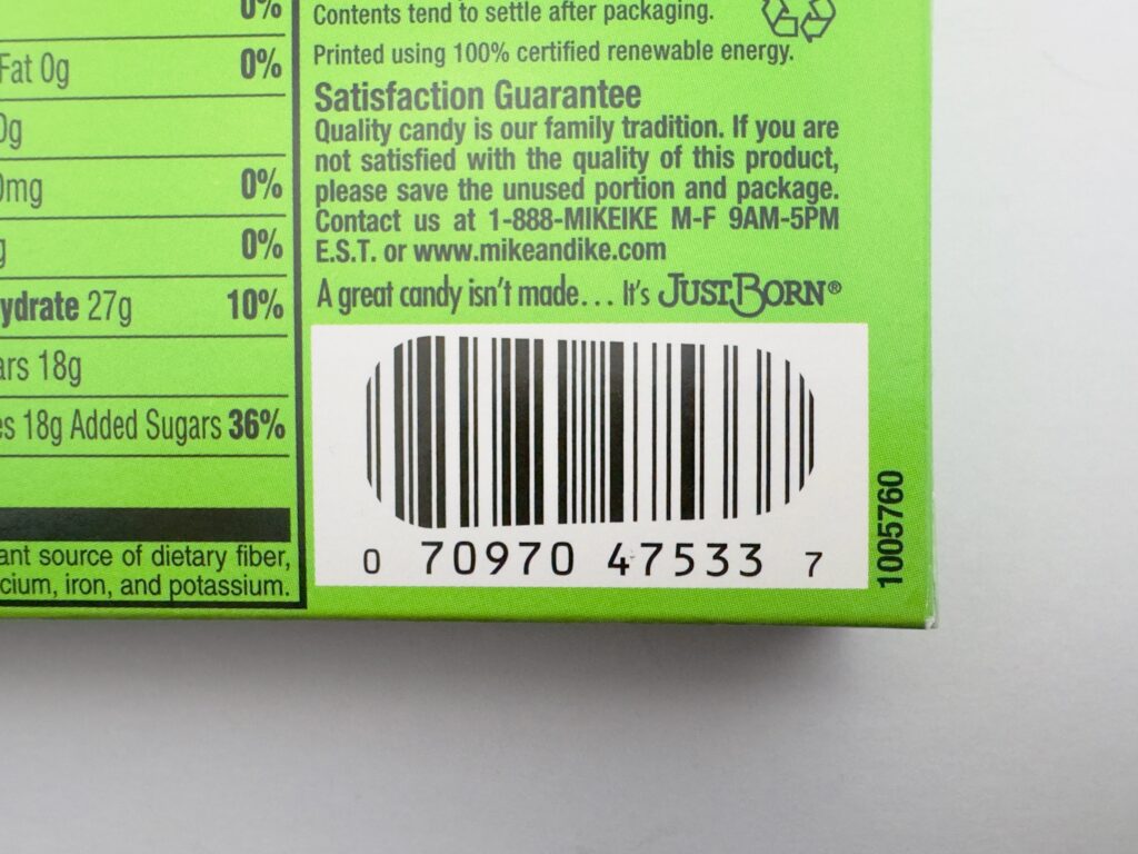 Close-up of the UPC barcode (0 70970 47533 7) and the "Just Born" manufacturer logo on a Mike and Ike box.