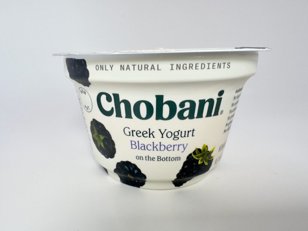 A single 5.3oz cup of Chobani Greek Yogurt Blackberry on the Bottom against a clean white background.