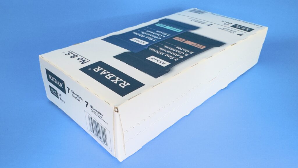 A high-angle perspective of the RXBAR 14-count variety pack from Costco, showing the top and side of the box with flavor counts and branding.